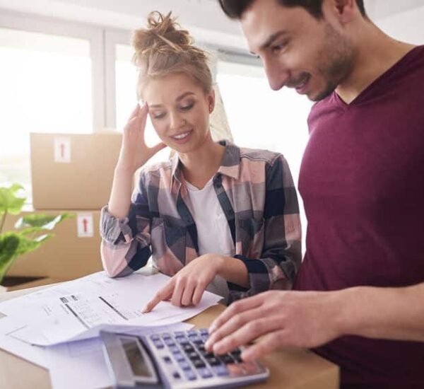 Worried couple examining expenses after moving into new house demenager pas cher