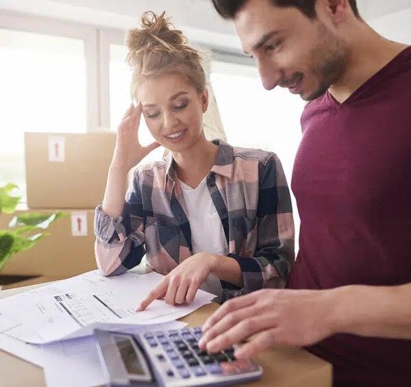 Worried couple examining expenses after moving into new house demenager pas cher